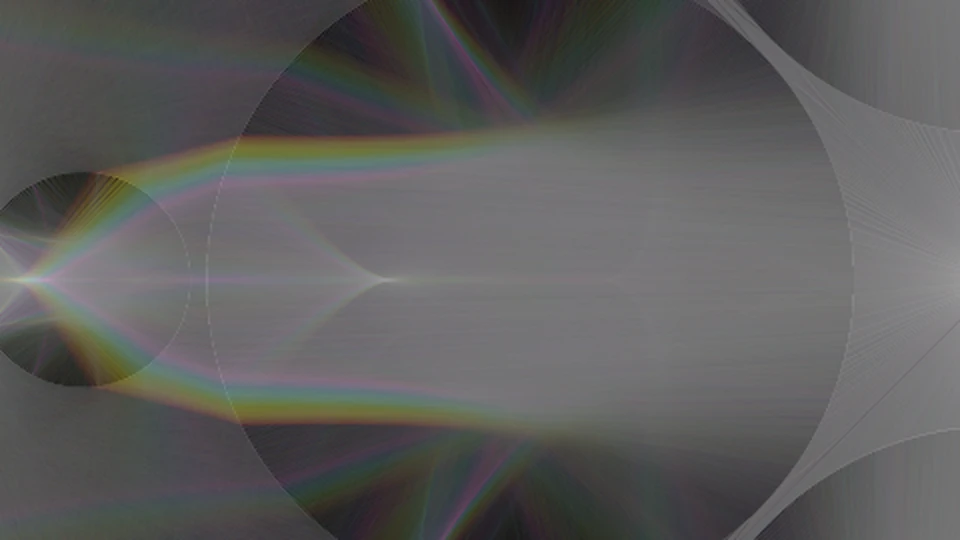 Close-up of a beam leaving a lens, split into red, green and blue bands